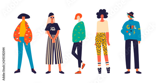 Five girls dressed in trendy clothes standing in various poses. Girl power concept. Female cartoon characters. Hand drawn colored vector set. All elements are isolated