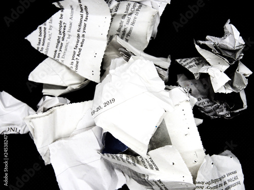 torn and crumpled newspaper