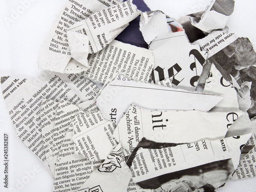 torn and crumpled newspaper