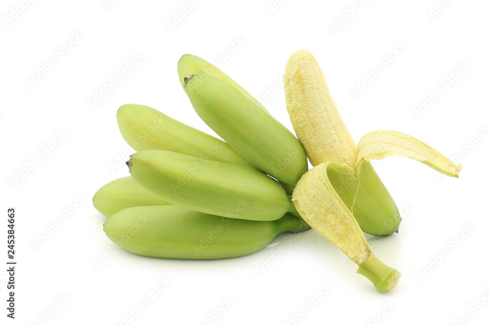 a bunch of small snack bananas and a peeled one on a white background