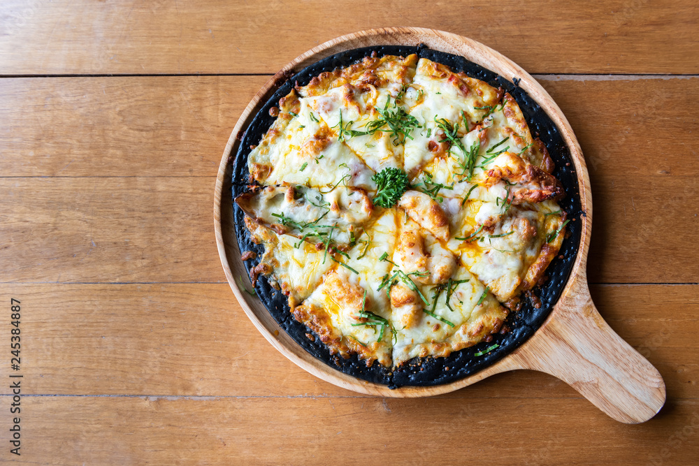 Seafood chaco pizza on wooden table with copy space Seafood chaco pizza on wooden table with copy space