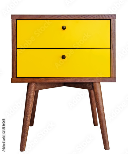 Yellow wood bedside table. Modern designer nightstand isolated on white background front view. cabinet with two drawers