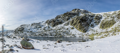 Glacial lagoon in the mountains of Madrid called Laguna Grande de Peñalara photo