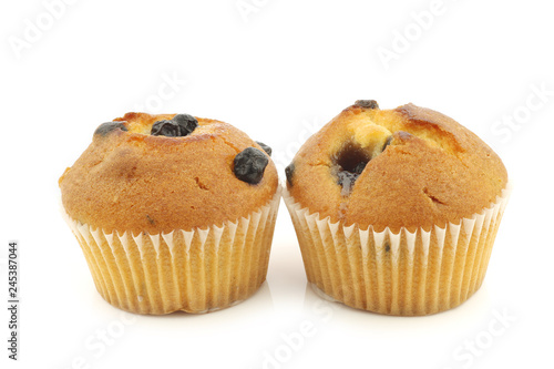 freshly baked blueberry muffins on a white background