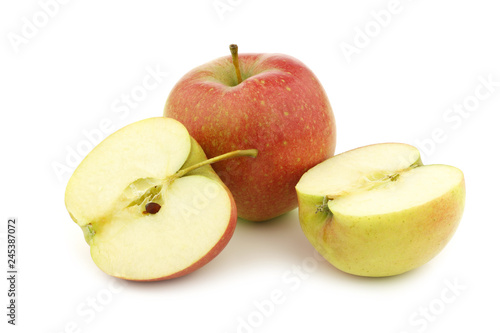 fresh Maribelle apple and a cut one on a white background