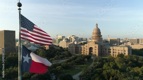 4K Texas Capital with Texas Flag and American Flag Aerial Slow Motion