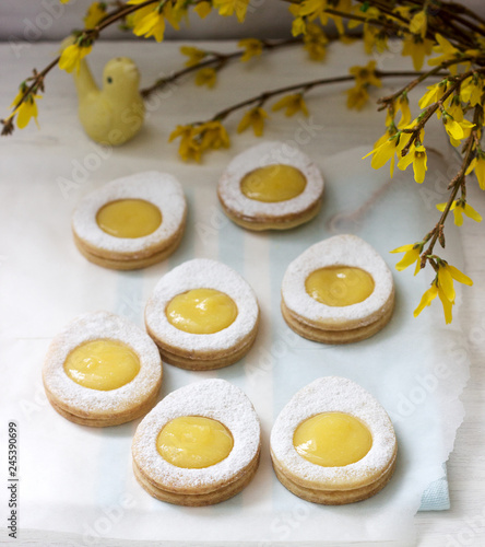 Wallpaper Mural Homemade Easter lemon cookies and forsythia blooming twigs on a light background. Torontodigital.ca