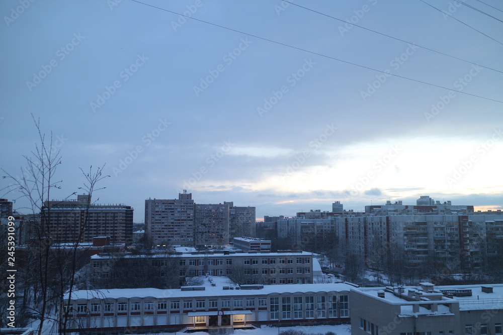 Dawn over the city block in winter
