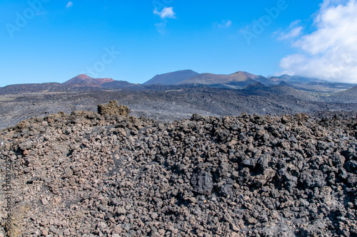Edge of the volcanic lava field with Teneguia volcano in the background La Palma Island, Canaries, Spain