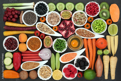 Fototapeta Naklejka Na Ścianę i Meble -  Health food for fitness  concept with dairy, fresh fruit, vegetables, grains, cereal, seeds, pollen grain, herbs and spice. High in antioxidants, protein, anthocyanins, vitamins and dietary fibre.