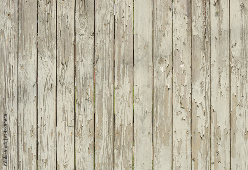 Wooden background with peeling white paint