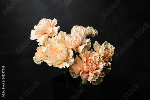 flower Ikibana on a black background, bouquet in a glass vase