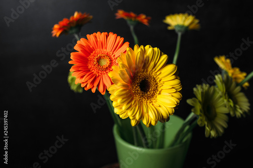 flower Ikibana on a black background, bouquet in a glass vase