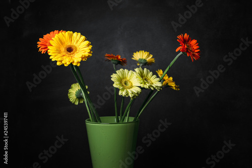Fototapeta Naklejka Na Ścianę i Meble -  flower Ikibana on a black background, bouquet in a glass vase