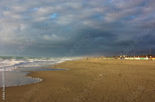 romantic and dreamy panorama of the sea of       versilia in tuscany. a peaceful day despite the cold of winter. rest and relaxation