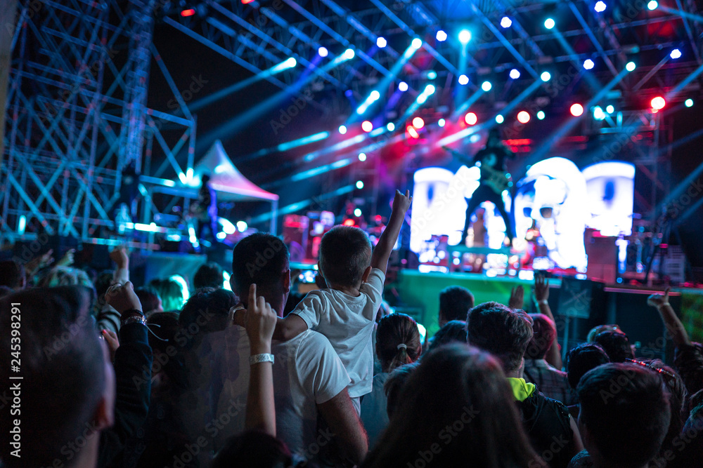 Concert crowds. Crowded concert scene with adults and children