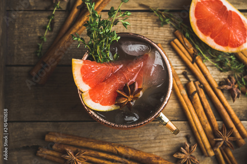 Photography Grapefruit moscow mule in copper mug on the rustic background