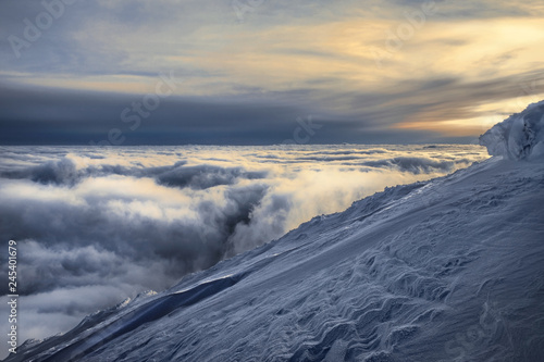 Evening over clouds in Karpaty mountains © Yurii