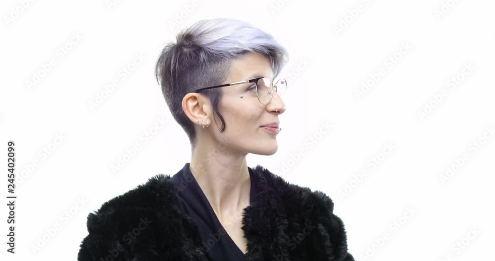 Beautiful young white hair cool adult woman with trendy eyeglasses and piercing happy smiling wearing eco fur coat.Person action.People video portrait isolated on white background.Medium shot.4k video Beautiful young white hair cool adult woman with trendy eyeglasses and piercing happy smiling wearing eco fur coat.Person action.People video portrait isolated on white background.Medium shot.4k video