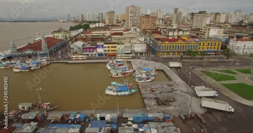 Sideways aerial of boats in dock and colonial facades in old port town of Belem do Para in the Brazilian Amazon photo