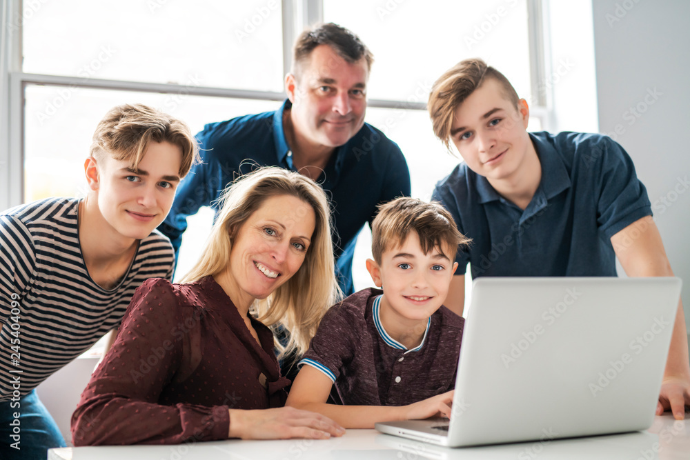 A big family looking in computer at home A big family looking in computer at home