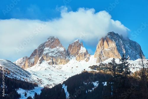 The Sassolungo Group massif covered in snow