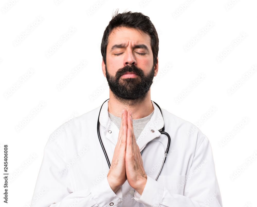 Young doctor in zen position on white background Young doctor in zen position on white background