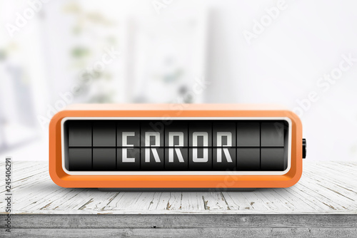 Error message on a wooden desk with a retro alarm
