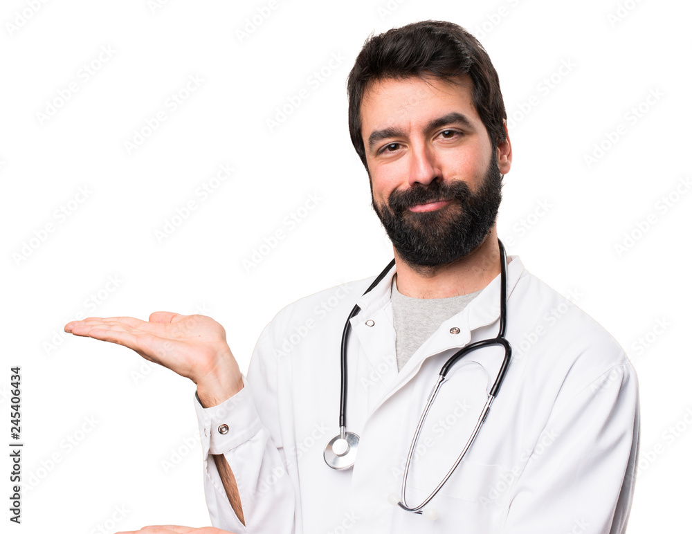 Young doctor presenting something on white background Young doctor presenting something on white background