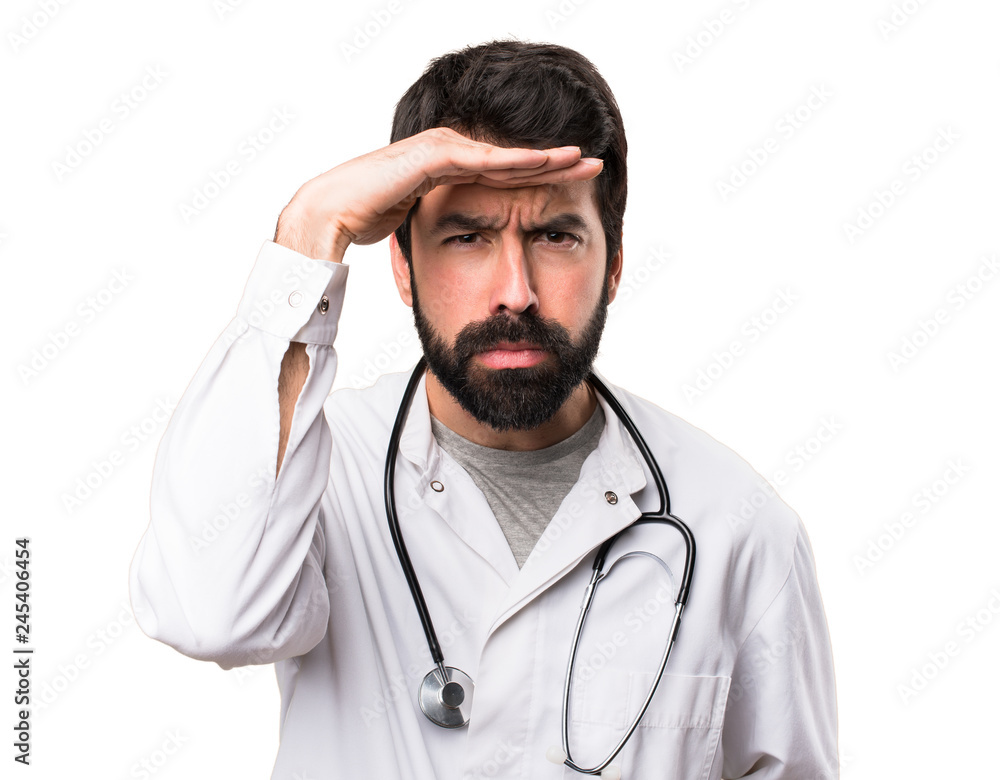 Young doctor showing something on white background Young doctor showing something on white background