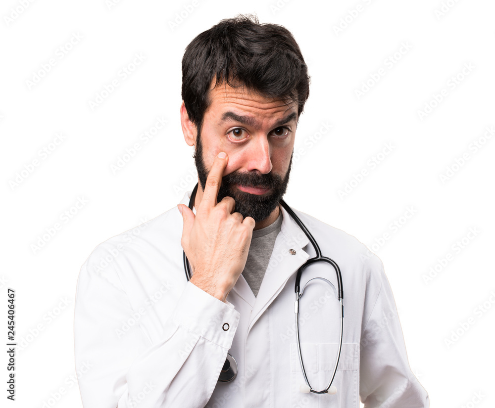 Young doctor showing something on white background Young doctor showing something on white background