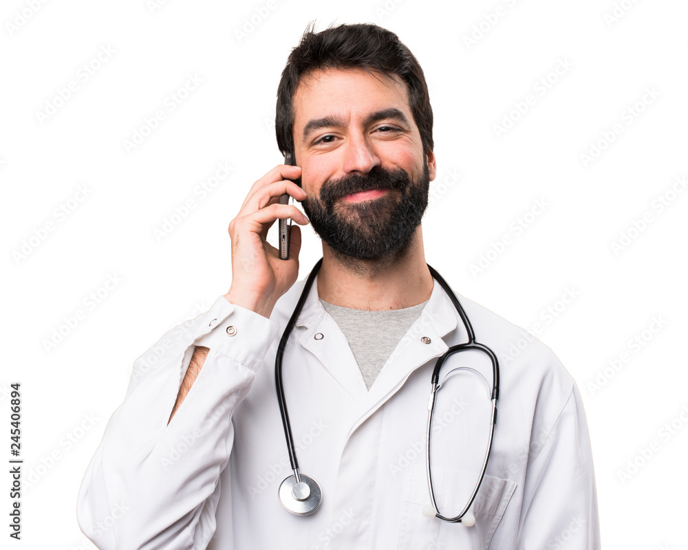 Young doctor talking to mobile on white background Young doctor talking to mobile on white background