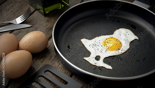 Kitchen composition, chick-shaped egg on skillet