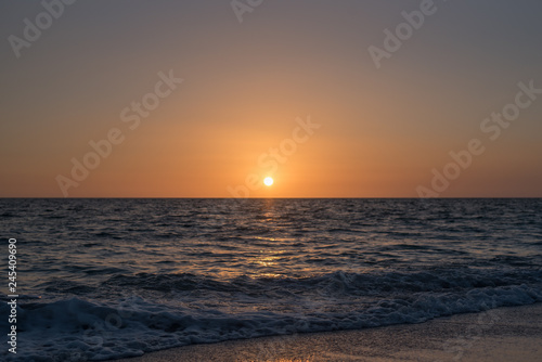 Calm dim sunset over ocean © Katherine