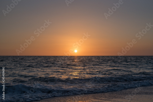 Calm dim sunset over ocean