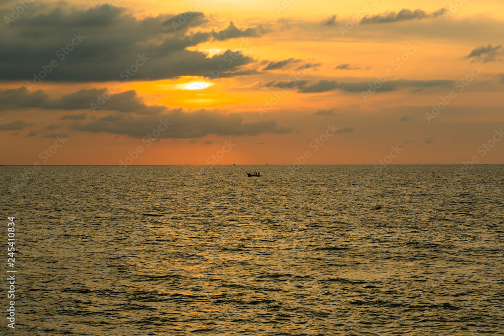 Silhouette of a boat at sunset