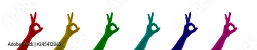 Collage of hand sign OK colored on red, yellow, green, blue, cyan, pink, magenta on the white background isolated 