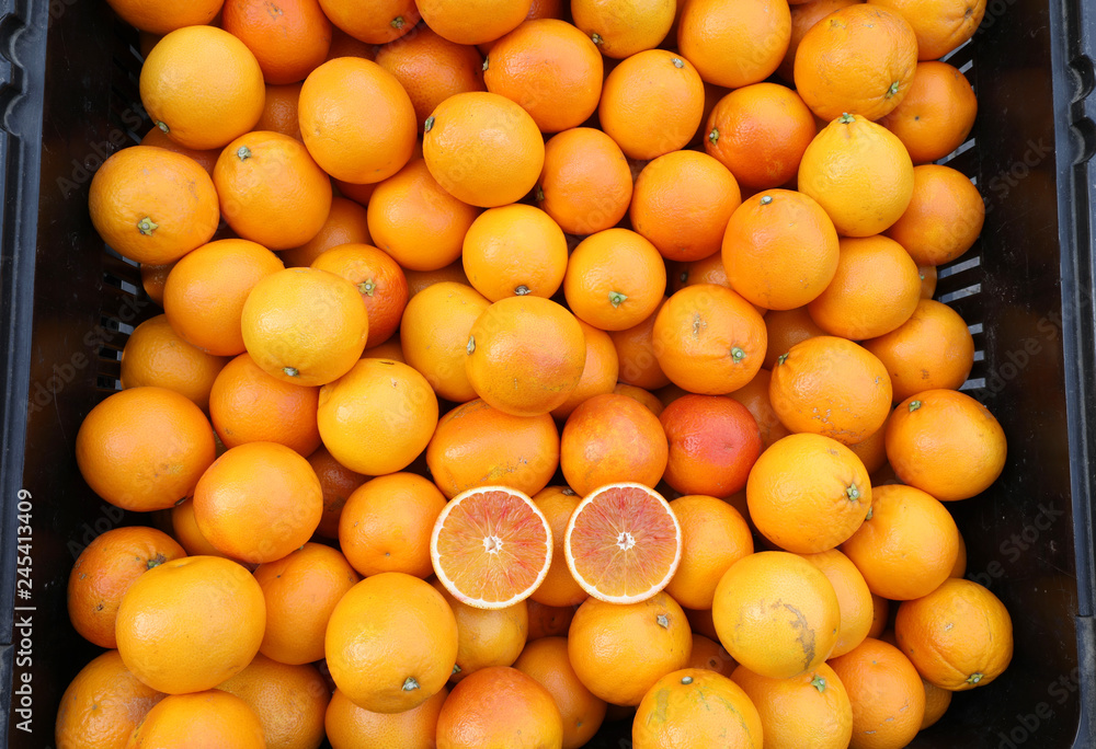 many red Sicilian oranges in a greengrocer