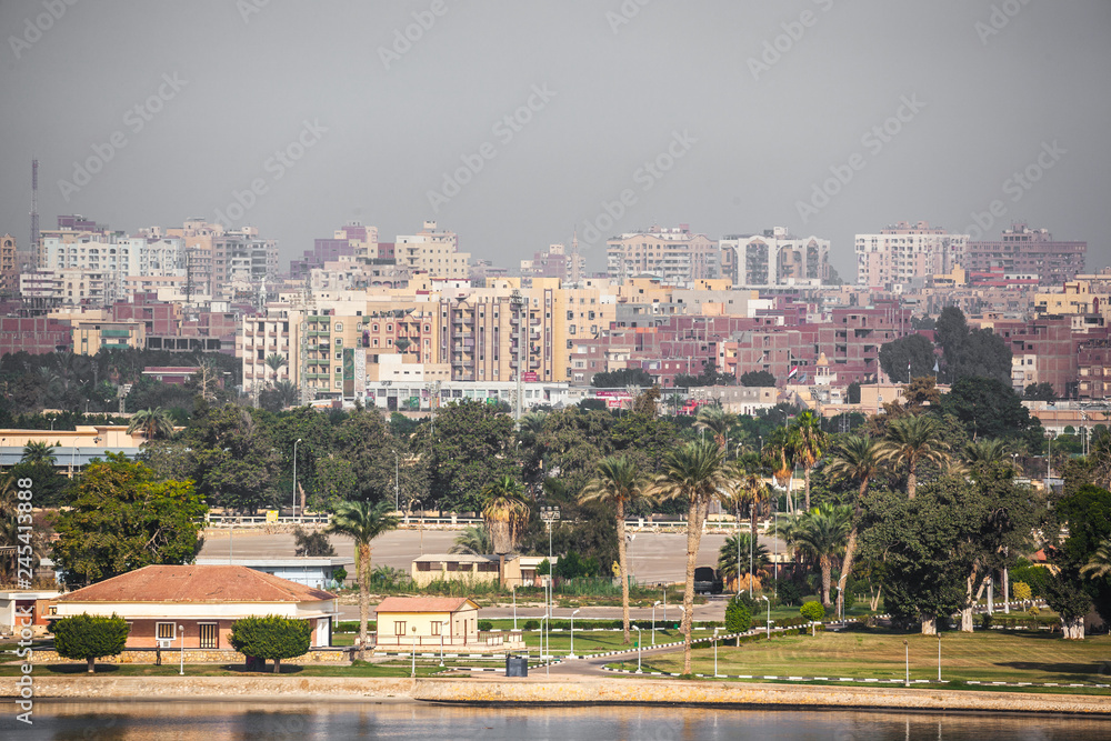 A beautiful city on the Suez Canal. With many skyscrapers in the background.