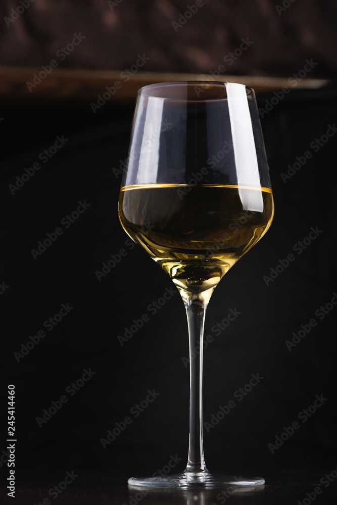 Glass of White Wine on Black Background