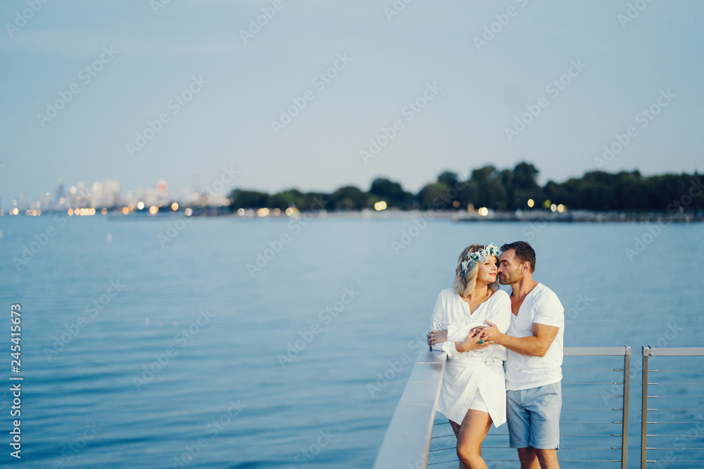 elegant adult couple near sea