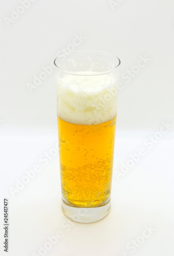 Glass of beer on a light background