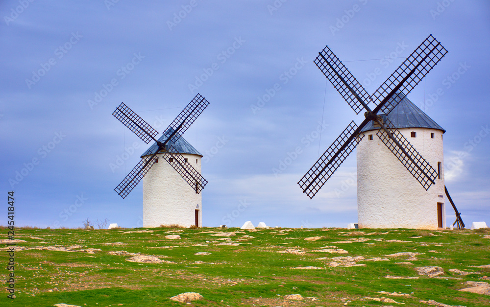 CAMPO DE CRIPTANA, SPAIN - NOVEMBER 22, 2018: Windmills of the route of Don Quixote, Castilla La Mancha, Spain. Sunset on a cloudy day