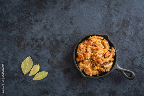 Bigos-traditional Polish dish of finely chopped sauerkraut and fresh cabbage with meat, mushrooms, and sausage. The dish is also traditional for Belarusian, Ukrainian and Lithuanian cuisine. photo