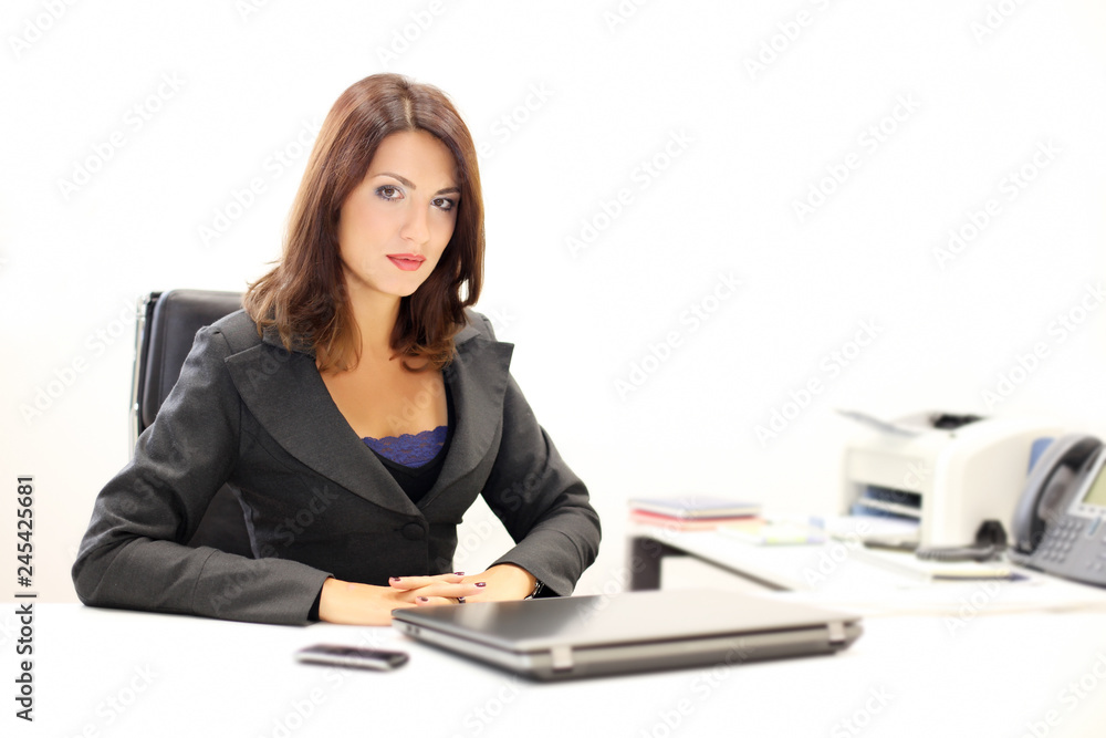 Beautiful businesswoman posing in her office Beautiful businesswoman posing in her office