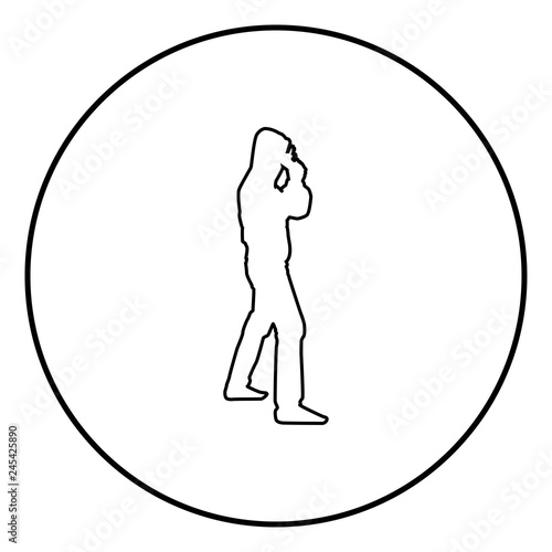 Man in the hood with gun Concept danger short arm near head icon black color illustration in circle round