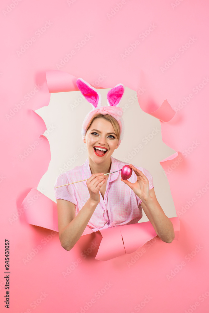 Happy easter! Happy bunny woman painting egg. Easter concept. Easter egg ideas. Painting eggs. Sale. Discount. Easter egg decorating ideas. Woman through paper. Pin up girl. Pink rabbit. Happy easter! Happy bunny woman painting egg. Easter concept. Easter egg ideas. Painting eggs. Sale. Discount. Easter egg decorating ideas. Woman through paper. Pin up girl. Pink rabbit.