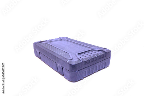 Black plastic tool case on the side on white isolated background