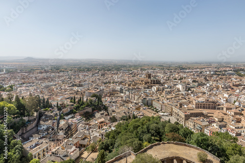 Cityscape of Granada. Granada is a popular destination among the tourist cities of Spain, mainly because of Alhambra palace complex, which is part of UNESCO World Heritage.