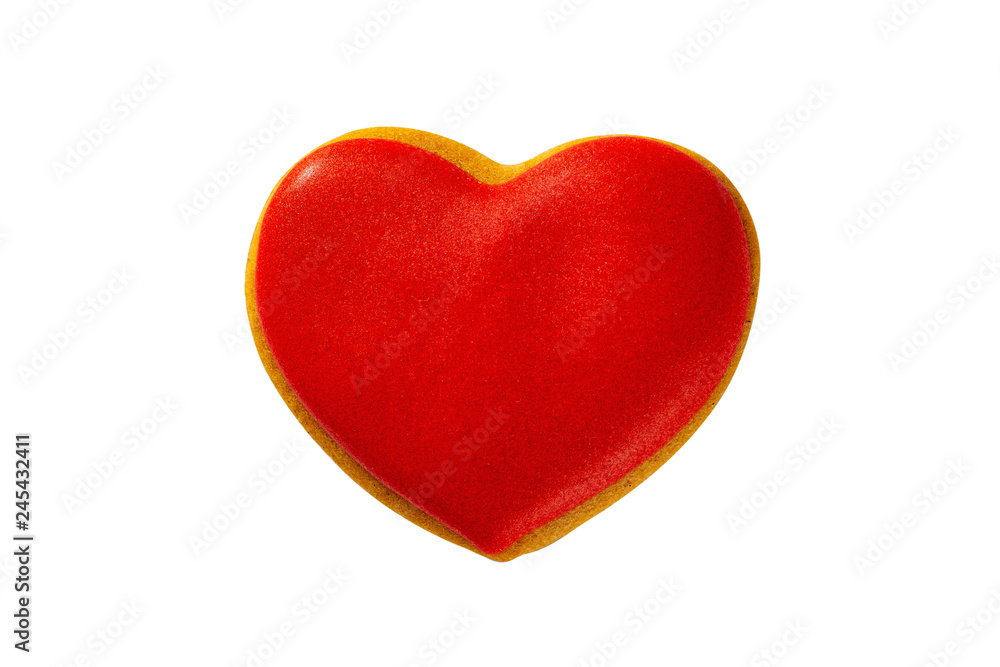 Closeup gingerbread red heart cookie as a symbol of Valentines day isolated at white backkground.